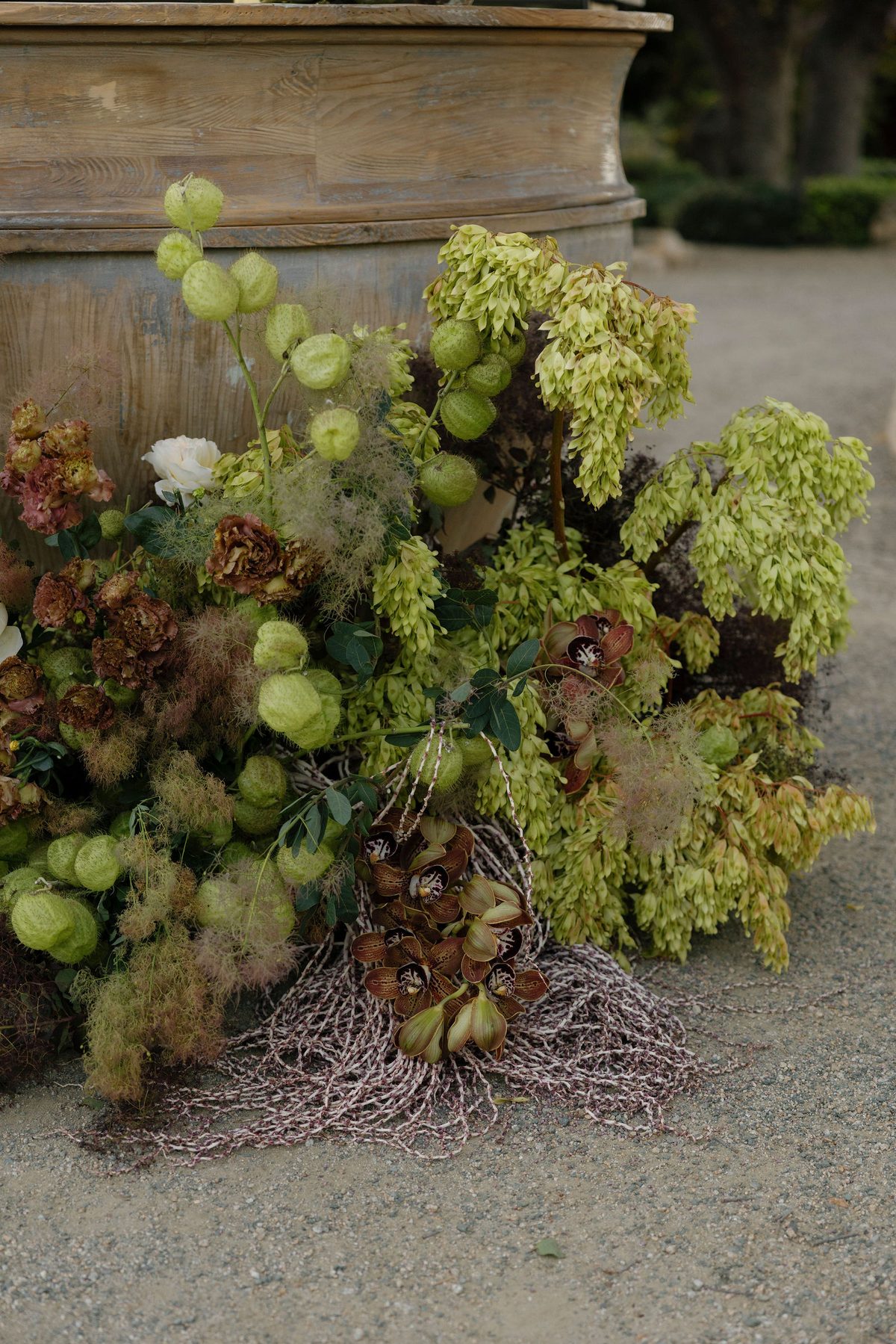 Florals spilling over a stone urn