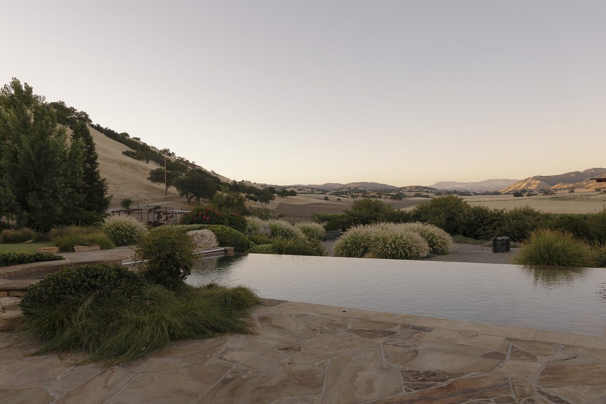 The infinity edge of the pool above the hills