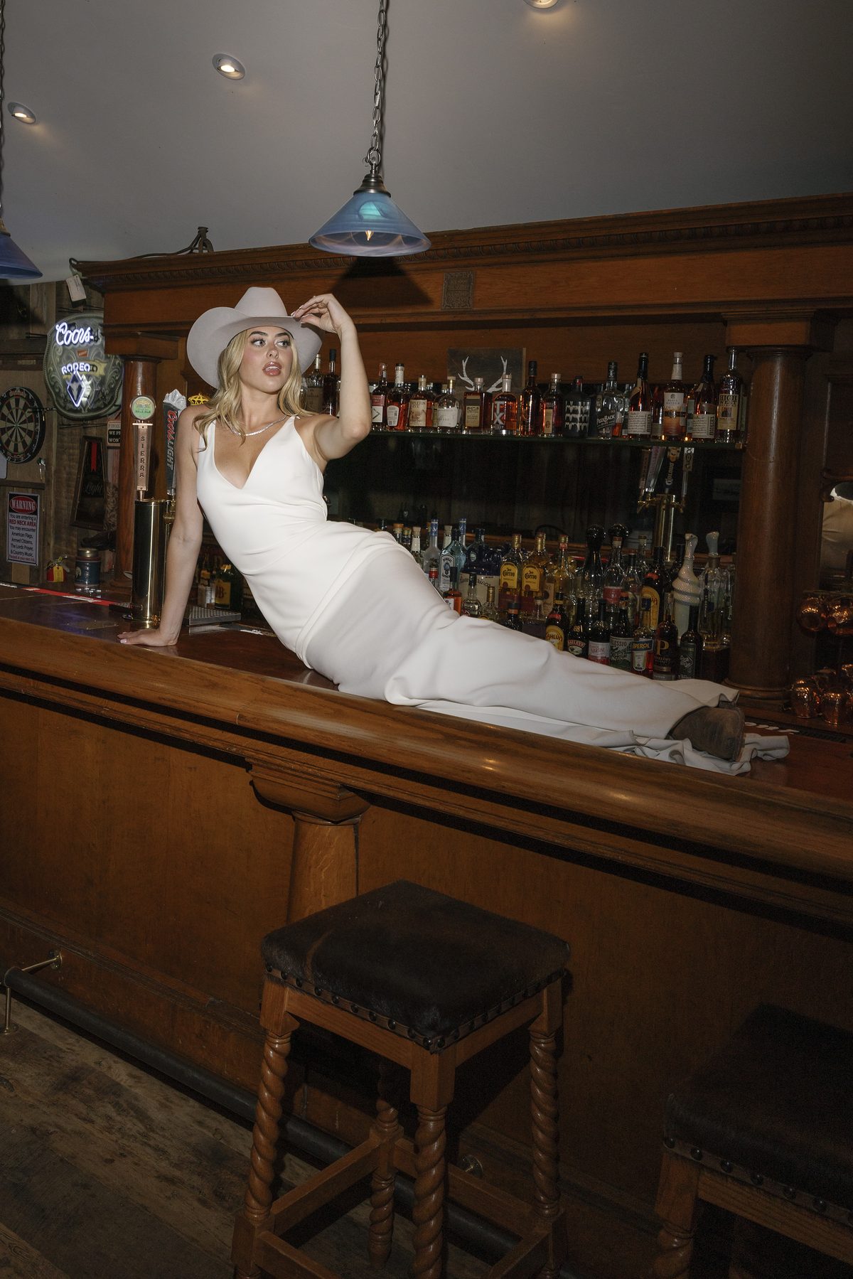 The bride reclining on the saloon bar